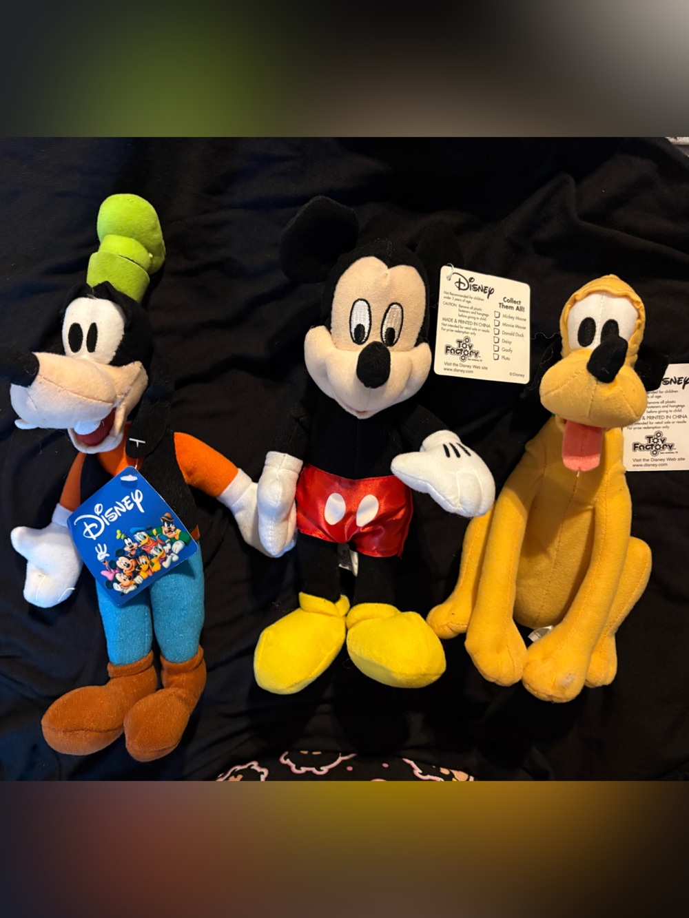 Disney White and Black Toy Factory Collectible Tag